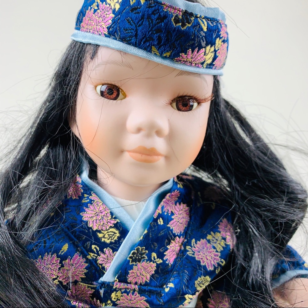 Porcelain Doll- 16”-excellent condition. Blue.